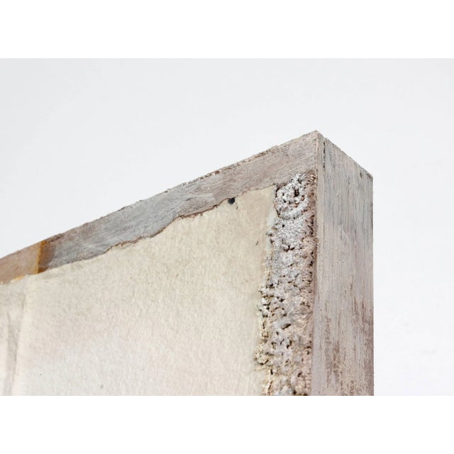 This 1984 cement, paint, metal, and paper mixed media abstract mounted to wood panel is by Northern California artist Hugh...