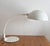 Model 660 table lamp designed by Elio Martinelli for Martinelli Luce, Plastic and metal painted white, movable arm, 1970s....