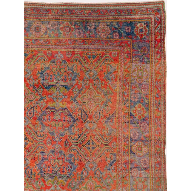 An antique Turkish Oushak large room size carpet. The unusual abrashed light blue ground shows a three column Yaprak...