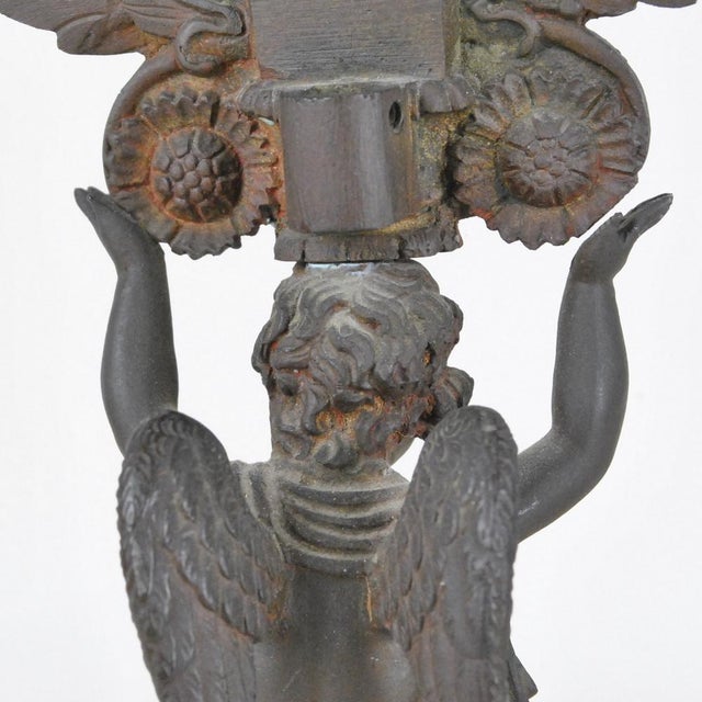 Double patina bronze table mirror, with a kneel kneeled angel supporting the round mirror with a laurel wreath Catering...