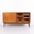 Danish design sideboard from the 1960s made of teak. The sideboard features sliding doors with interior drawers and...