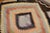 Room size Turkish Kilim from the mid-20th century. The field is brown, accents in canteloupe, peach, light green and...