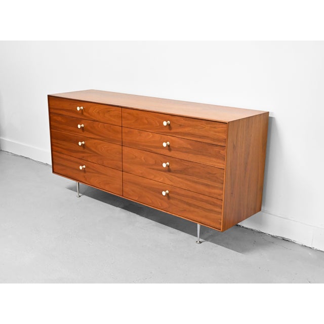 Vintage 8 drawer "Thin Edge" dresser constructed in beautifully grained walnut by George Nelson for Herman Miller....