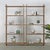 This tall vintage shelf offers vertical presence and quiet character, with a naturally weathered wood finish and simple,...