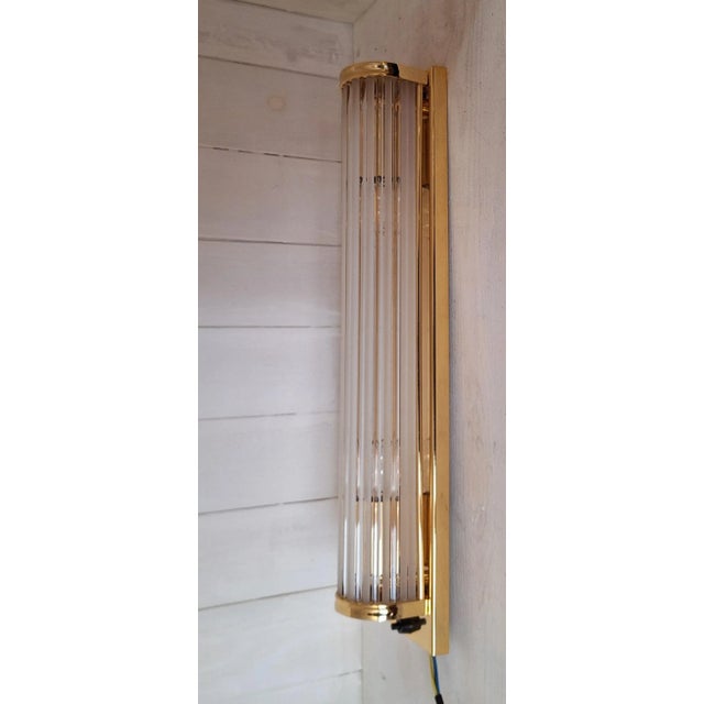 German Flat Wall Lamp with Gold-Plated Metal and Glass Rods Shade, 1980s, in Very Good conditions. Designed 1980 to 1989...