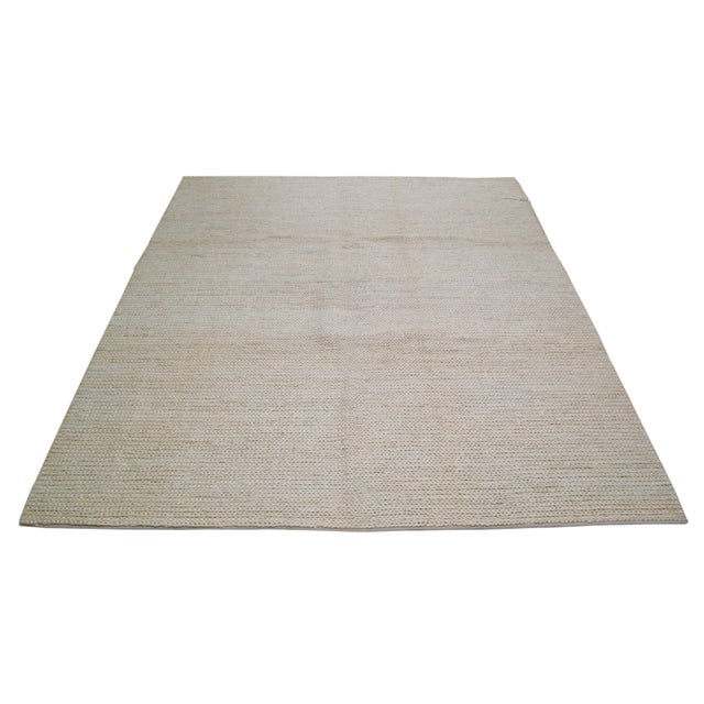 Hand-knotted with care using traditional rug-making techniques, this wool rug blends timeless craftsmanship with a modern...