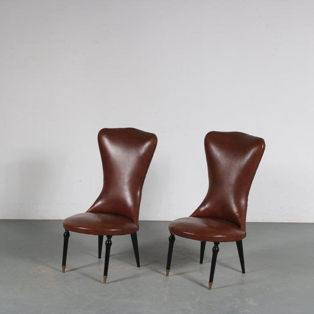 A beautiful pair of side chairs, manufactured in Italy around 1950. The tapered legs add nicely to the elegant style of...