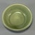 This shallow‑form bowl features classic Longquan‑style celadon glaze with soft mint‑green tone. The unglazed base shows...