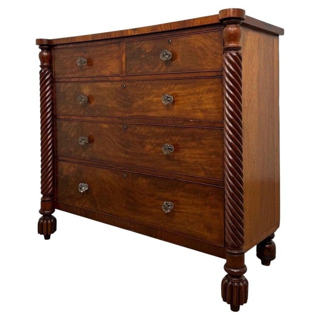 A handsome and substantial early 19th-century English Regency chest of drawers, beautifully crafted in richly figured...