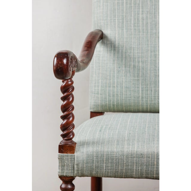 Two hand-carved walnut, Italian armchairs with barley twist fore columns above stretchers of the same. Each with...