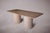 Elevate your dining experience with our exquisite Travertine Dining Table featuring cylindrical legs and vertical stone...