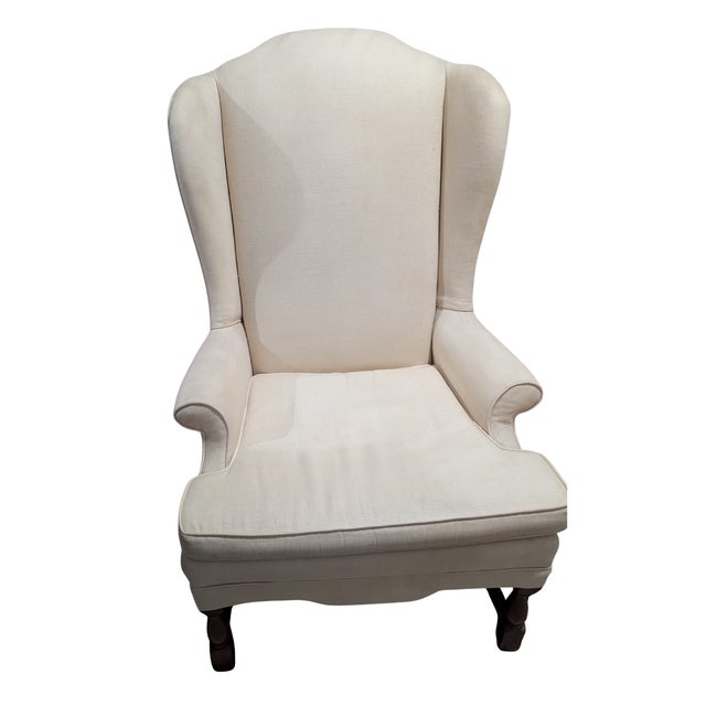 Pair of vintage traditional English/Colonial silhouette classic wingback chairs Features: - High scrolled wings - Rolled...