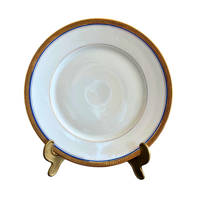 This refined Limoges porcelain set captures the essence of timeless French elegance, with its crisp white ground...