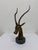 Mid-Century brass sculpture of a gazelle on top of a variegated Italian green marble base circa 1960s/1970s.