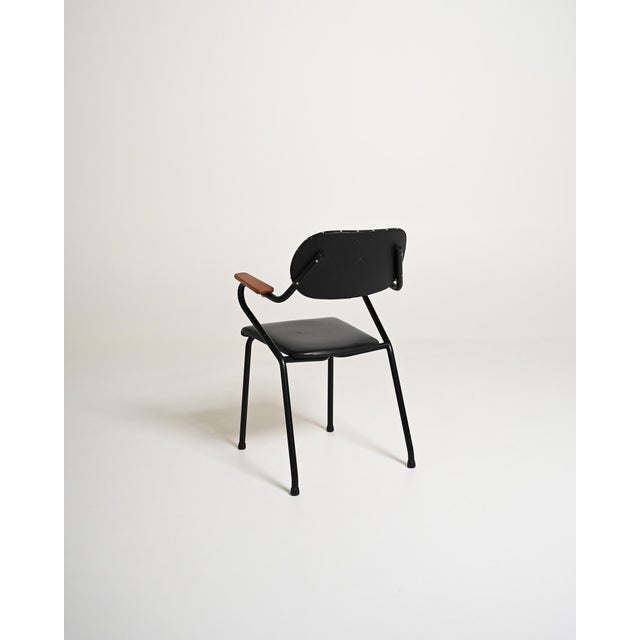 Black lacquered metal frame with black-painted teak elements and natural teak details. Scandinavian design, 1950s....