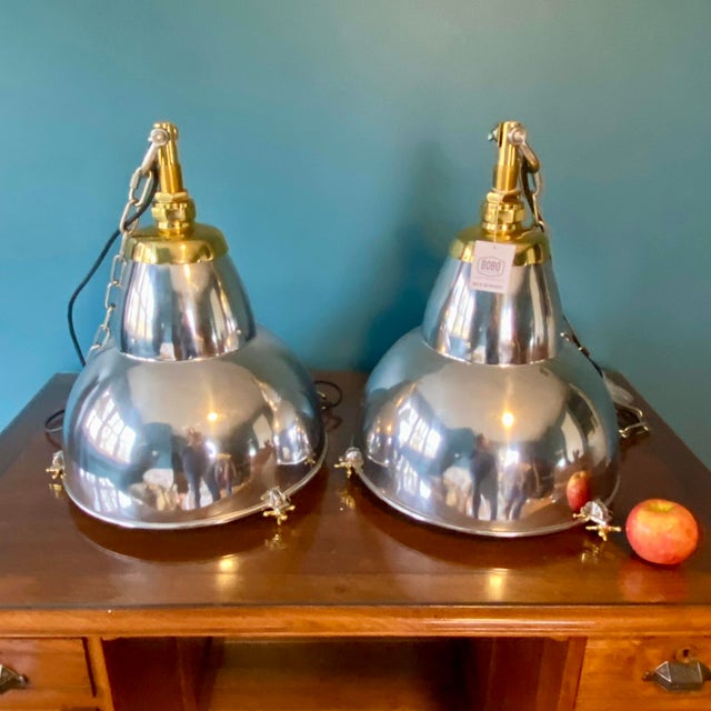 This pair of Bobo Intriguing Objects Industrial pendant lights are reproductions of classic early/mid-century French...