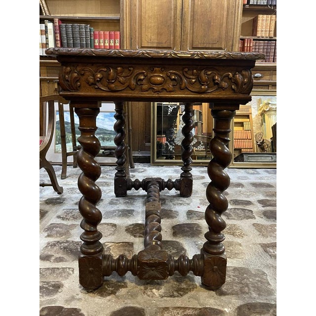 Henri II style table/desk in solid oak. Four molded, twisted column legs, with a drawer. The tabletop has a slightly deep...