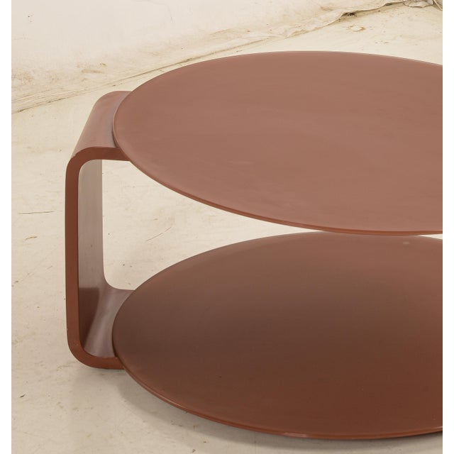 Coffee table round vintage wood and very nice red glass for the structure and the combination of materials, but it should...