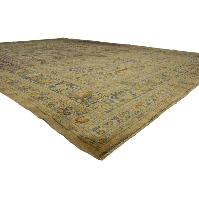 72983 Antique Persian Mashhad Rug, 11'00 x 16'00. Mashhad rugs, originating from the northeastern city of Mashhad in Iran,...