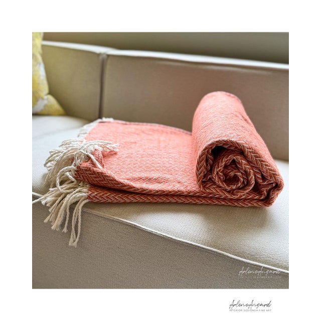 The “Marina Throw Jacquard” from Arlene Angard Designs and Fine Arts, a soft, high-quality throw made from recycled...