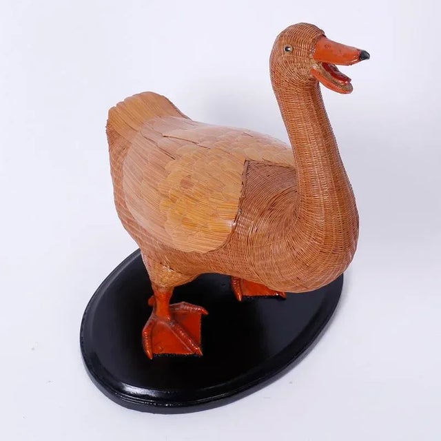 Wicker duck from with an intricate woven wicker structure and highlighted with wood wings and a sculpted bill and feet....
