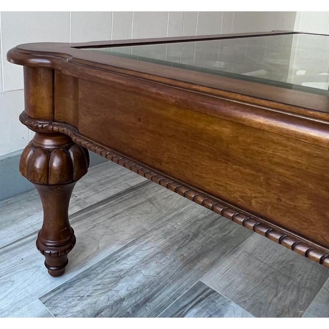Ethan Allen Tuscan style Devereaux coffee table. The detailed iron grate that sits below the beveled glass top is the...