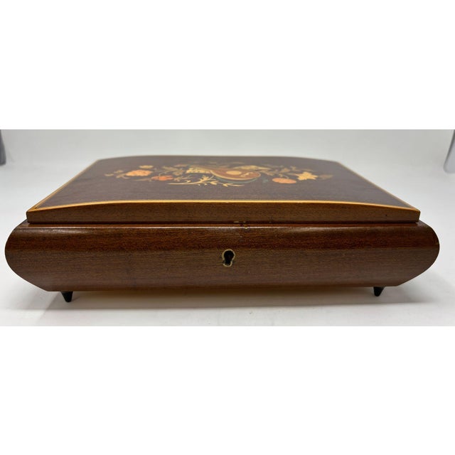 Elegant vintage footed wooden music box with top finely hand painted and inlaid with foliages floral decor. Vintage...