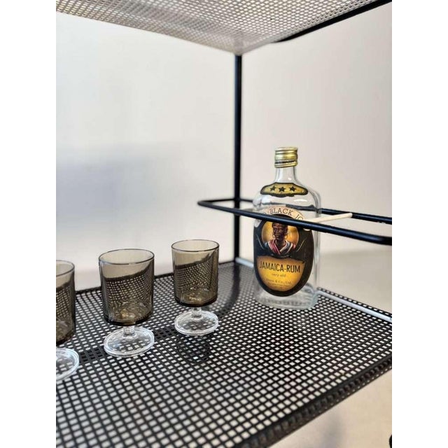 A stylish design from the 1960s, created by Tjerk Reijenga for Pilastro. This tea trolley exudes the elegance of Dutch...