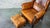 1970s Vintage Art Deco Distressed Cognac Leather Wingback Chair & Ottoman For Sale - Image 14 of 16