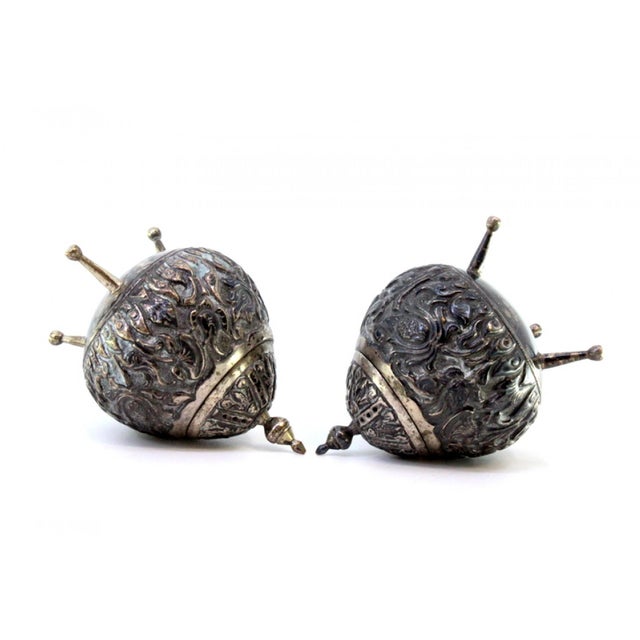 Salt Shakers in Embossed Silver, Set of 2, in Very Good conditions. Designed from 2000 This piece has an attribution mark,...