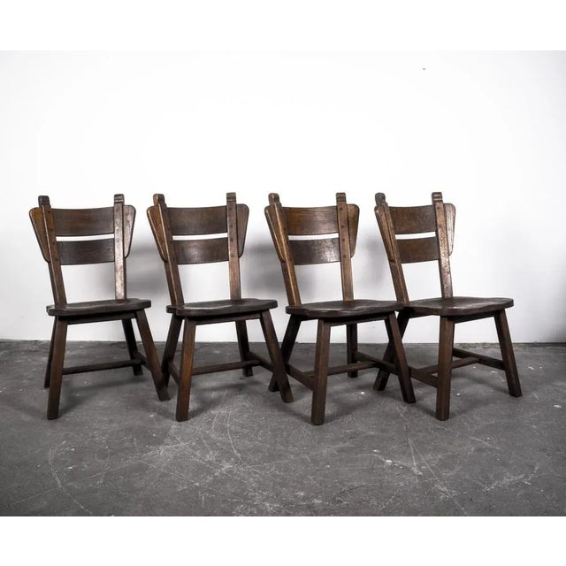 Mid-century german oak dining chairs from the 1960s high quality dining room chairs from the 60s. The chairs have a unique...