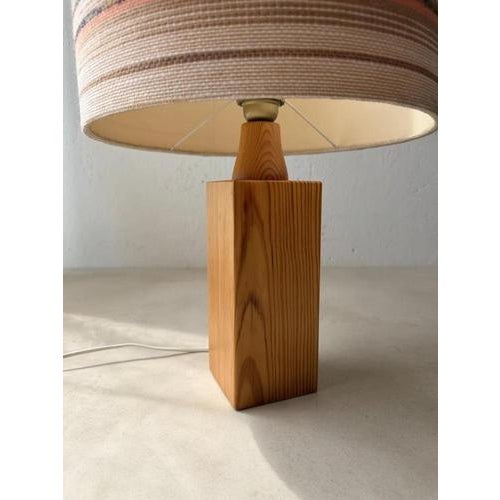A lamp that adds atmosphere to a room even during the day. This large vintage table lamp from the 1970s combines an...