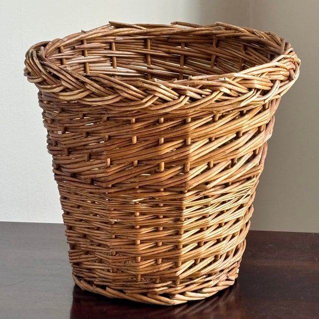 Offering a beautifully handwoven natural wicker wastepaper basket from the mid-20th century. This rustic European-style...