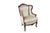 Set of two beautiful antique French bergère wingback armchairs. Made of walnut featuring classic Louis XV styling with...