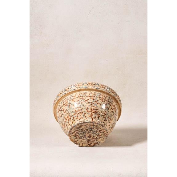 Large vintage spongeware bowl featuring hand-applied brown and blue decoration with a classic rounded form.