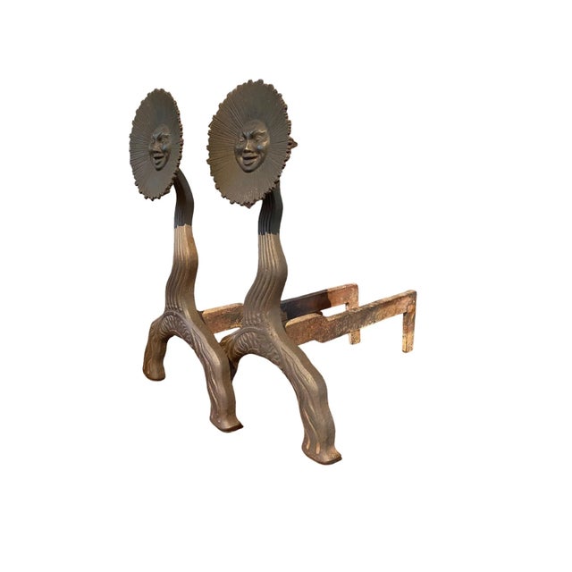 Bradley & Hubbard Mfg. Co. (American, Meriden, Connecticut, 1852–1940) A pair of iron andirons with a figural sunburst...