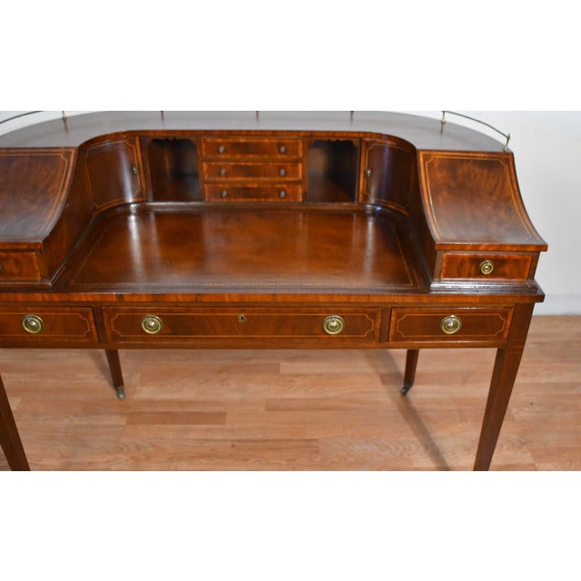 We are pleased to offer this beautiful English Carlton writing desk, from the 1930. This desk is made of Mahogany wood,...