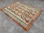 Beautiful Afghan Kilim Rug with Earthy Colors and Diamond Motifs This hand-woven Afghan Kilim rug is a stunning addition...