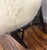 Vintage one of a kind stool. Black finish on wood. Seat is creme faux fur (also vintage). Large brass decorative ornaments...