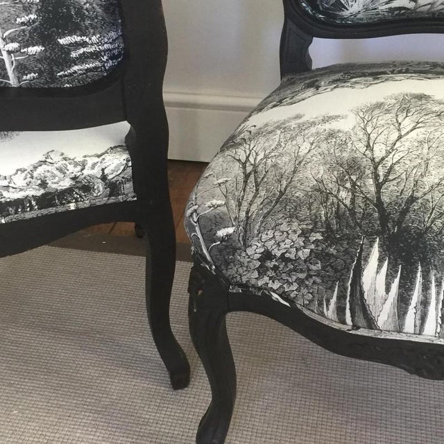 A pair of 19th century French ebonized side chairs upholstered in eye catching monochromatic linen with amazing engraving...