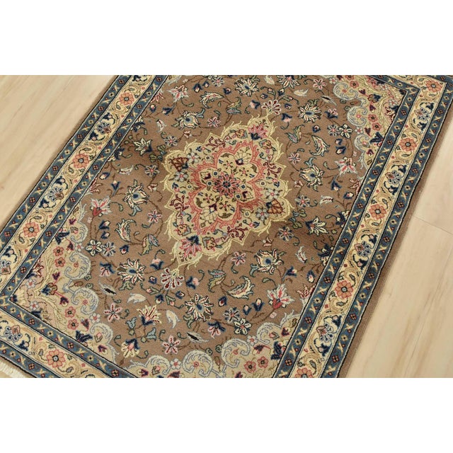 An authentic vintage traditional Kashan rug hand-knotted with fine wool and natural dyes. This intricately woven rug...