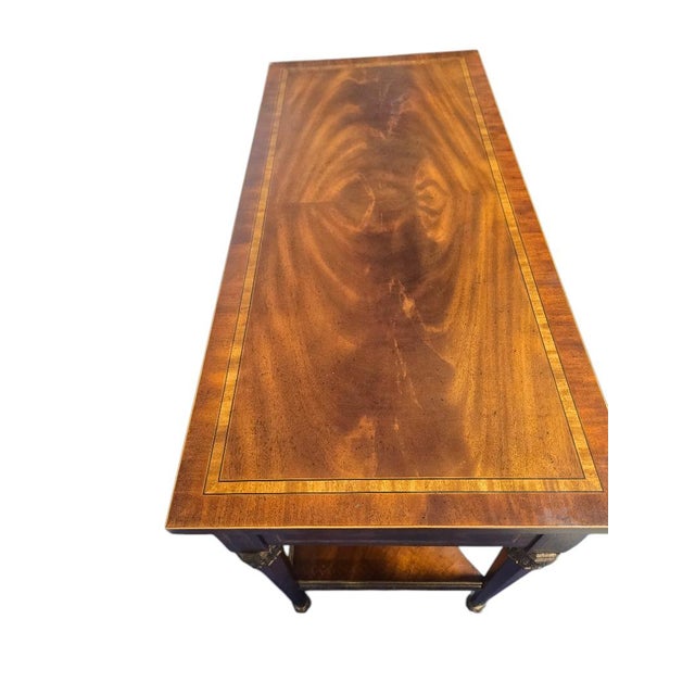 Beautiful Maitland-Smith console table featuring bookmatched mahogany veneers, inlaid banding, and solid brass/bronze...