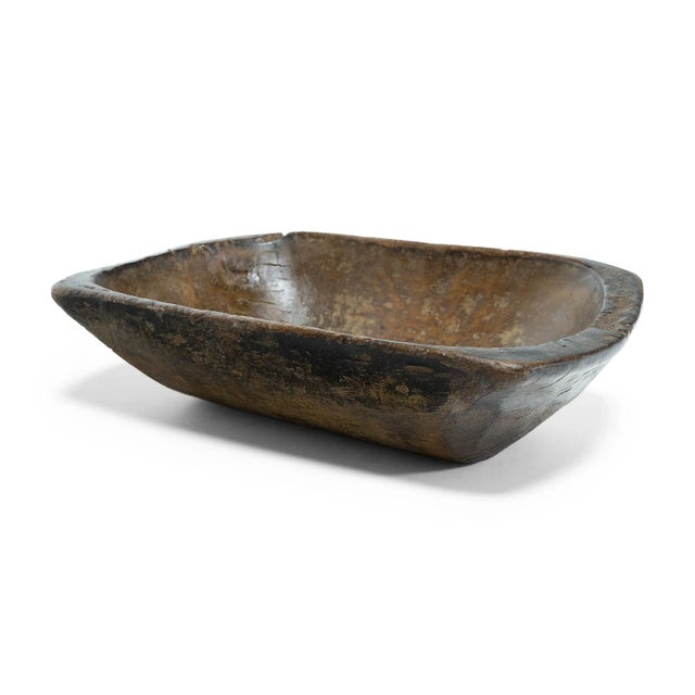 This wooden farm tray from northern China charms with its rustic finish and asymmetrical form. Hand-carved from a single...