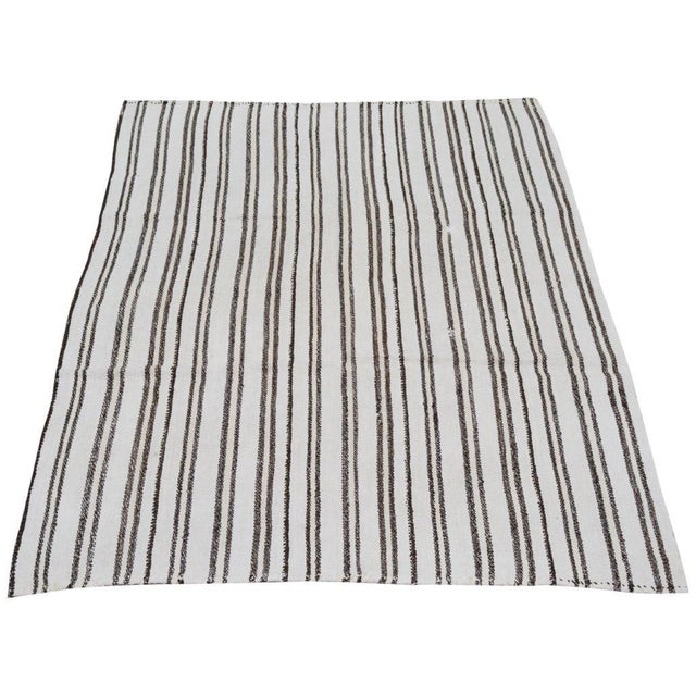 Flatweaved with care using traditional rug-making techniques, this wool rug blends timeless craftsmanship with a modern...