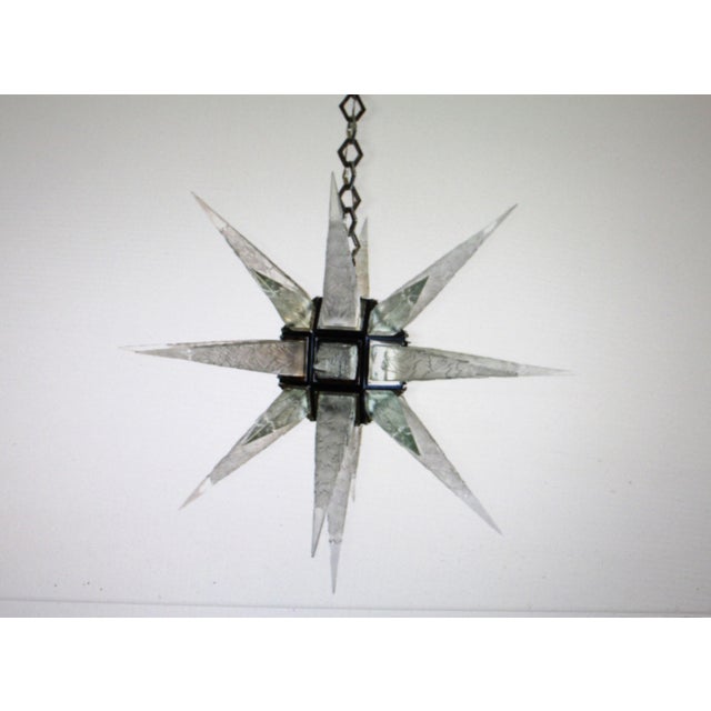 A Large Star Chandelier Custom Designed and Custom made. The main body is all machined to fit all the Acrylic Icicle...