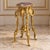 This elegant French Rococo-style side table features a slender, sculptural silhouette designed to add a refined decorative...