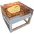 This cracked resin side table or coffee table is made from reclaimed teak infused with clear resin, which resembles a...