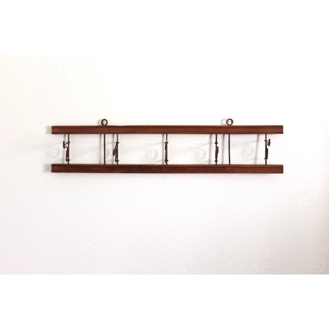 Unique antique clothing hanger with folding galvanized metal hooks. Lots of age and patina. 5 hangers. Grooved details in...