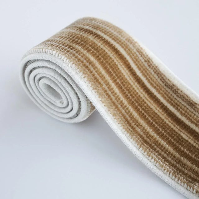 Gaspard Velvet Tape Narrow is a luxurious velvet tape, with its soft and silky pile, irregular tonal stripes and narrow...