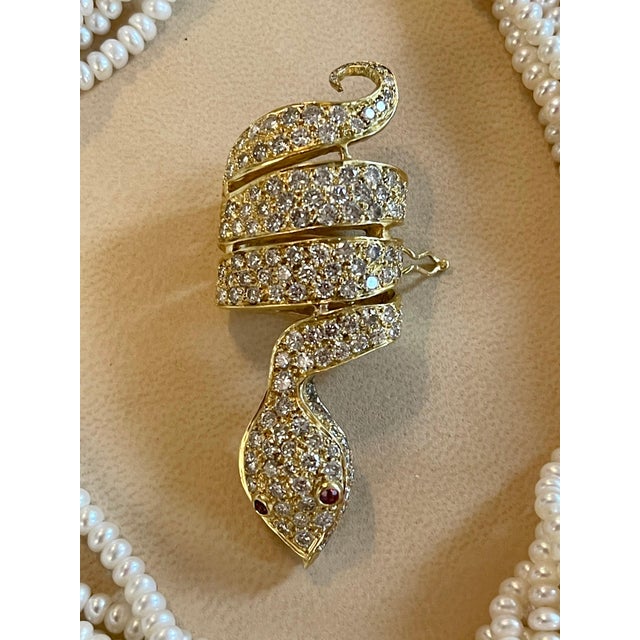 The opera length multi layer pearl necklace set consists of 11 original strands of Japanese pearls of lovely nacre,...